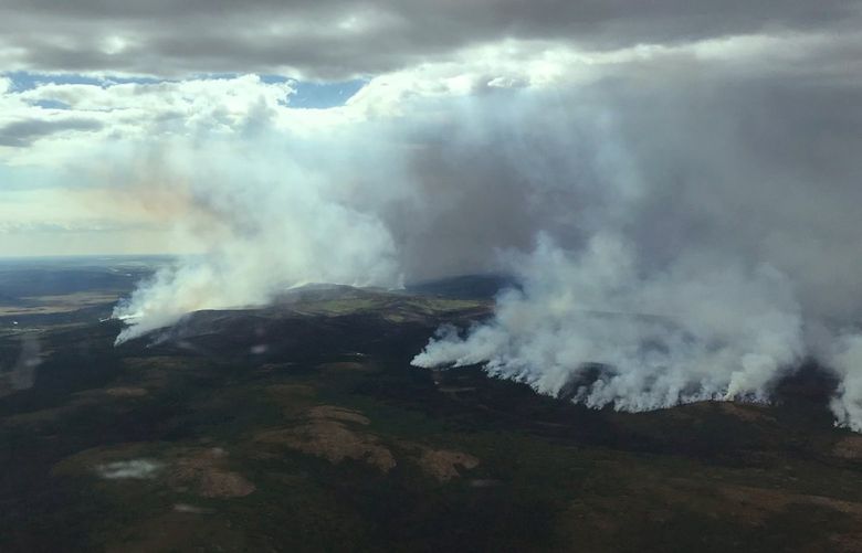 In this aerial photo provided by the BLM Alaska Fire Service, the east side of the East Fork Fire is seen near St. Mary’s, Alaska, on June 9, 2022. The largest documented wildfire ever burning through tundra in southwest Alaska is within miles of two Alaska Native villages, prompting dozens of residents with respiratory problems to voluntarily evacuate. (BLM Alaska Fire Service via AP) FX509 FX509