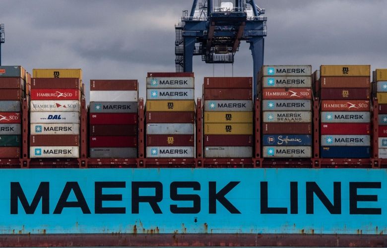 People walk past a Maersk container ship at the Port of Felixstowe Ltd. in Felixstowe, U.K., on Wednesday, Sept. 15, 2021. (Chris J. Ratcliffe/Bloomberg)