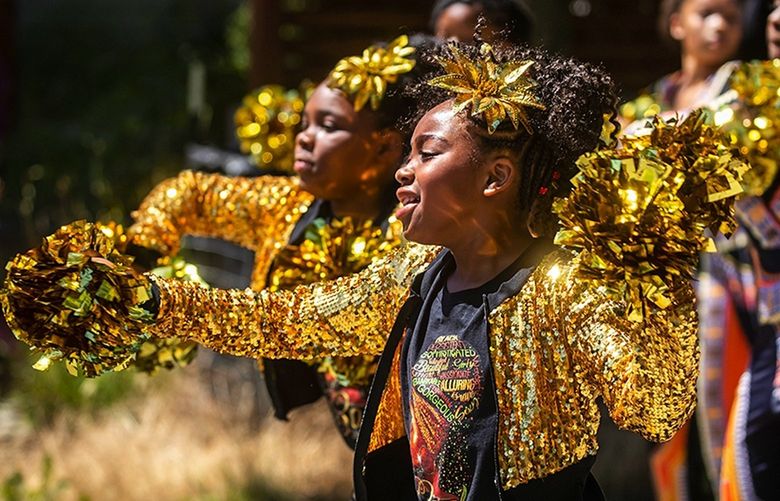 Myjestie Stanton-Phillips, 9, dances with the Electronettes Hi-Steppers Drill Team at the Juneteenth Freedom March and Festival along 23rd Avenue East in Seattleís Central District neighborhood Saturday June 19, 2021. Juneteenth, recently recognized as a federal holiday, commemorates the day in 1865 that Union troops arrived in Galveston, Texas, to command freedom for all enslaved people, more than two years after the Emancipation Proclamation. It celebrates the end of slavery in the United States.