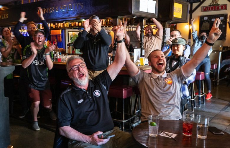 Soccer fans gathered at the George and Dragon Pub in Fremont to cheer the awarding of World Cup Soccer games to Seattle for the 2026 Championship by FIFA Thursday, June 16, 2022. 220704