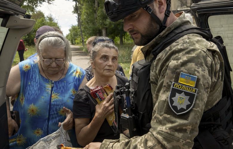 Ukrainian soldiers and police deliver food supplies to residents in Lysychansk, Ukraine, June 16, 2022. (Tyler Hicks/The New York Times) XNYT5 XNYT5