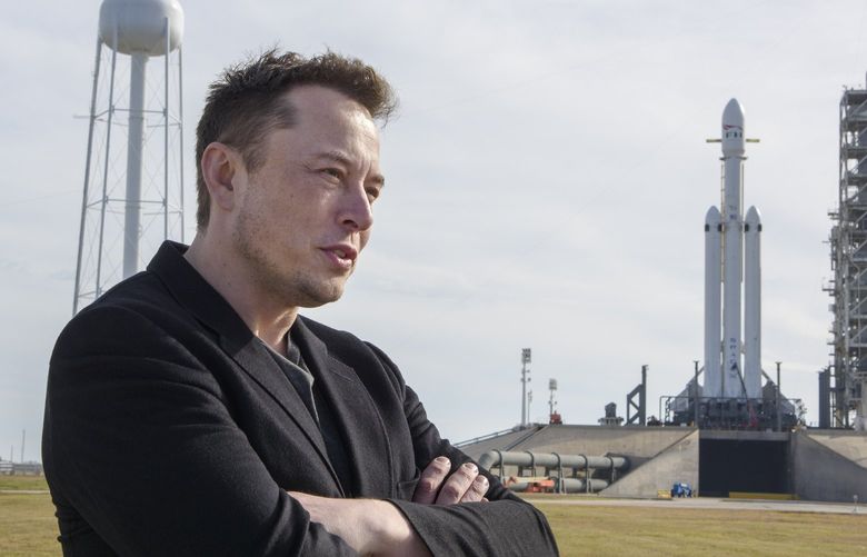 FILE — Elon Musk, founder of SpaceX, speaks to reporters with the company’s Falcon Heavy rocket standing by at Launch Pad 39A at NASA’s Kennedy Space Center in Cape Canaveral, Fla., Feb. 5, 2018. Employees at SpaceX have written an open letter in June 2022 denouncing the behavior of Musk, the company’s chief executive, following recently publicized allegations of sexual misconduct against him. (Todd Anderson/The New York Times) 
