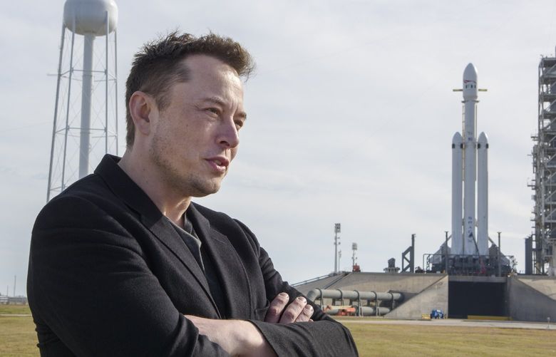 FILE — Elon Musk, founder of SpaceX, speaks to reporters with the company’s Falcon Heavy rocket standing by at Launch Pad 39A at NASA’s Kennedy Space Center in Cape Canaveral, Fla., Feb. 5, 2018. Employees at SpaceX have written an open letter in June 2022 denouncing the behavior of Musk, the company’s chief executive, following recently publicized allegations of sexual misconduct against him. (Todd Anderson/The New York Times)