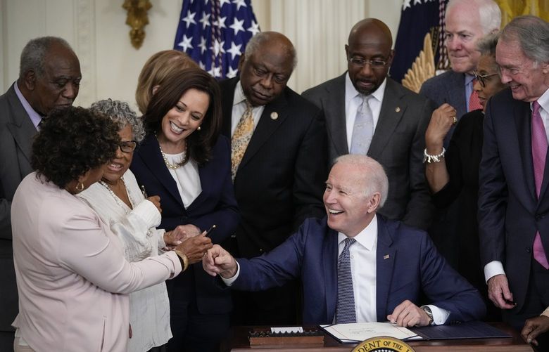U.S. President Joe Biden signs the Juneteenth National Independence Day Act into law in the East Room of the White House on June 17, 2021, in Washington, D.C. (Drew Angerer/Getty Images/TNS) 50507966W 50507966W