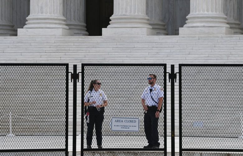Police personnel are seen outside the Supreme Court of the United States on Wednesday, June 08, 2022, in Washington, D.C. MUST CREDIT: Washington Post photo by Matt McClain.