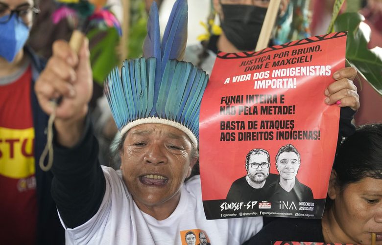 Guarani Indigenous and human rights activists rally in support of British journalist Dom Phillips and Indigenous expert Bruno Perreira, demanding authorities conduct a thorough investigation into the circumstances leading to their deaths, and do more to protect indigenous lands against illegal miners, loggers, and fishermen, in Sao Paulo, Brazil, Saturday, June 18, 2022. (AP Photo/Andre Penner) XAP111 XAP111