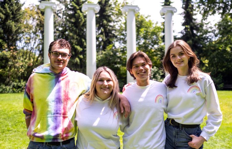 Sean Haney, left, is president of UW Greek Pride, a LGBTQ+ focused club at UW working to make a traditionally conservative, straight space more inclusive.  He is joined by club members (second from left, to right) Haidyn Hall, Erik Eykel, and Erica Schieche at the Four Columns at Sylvan Grove on the UW campus. 

Photographed Tuesday, June 21, 2022 220734