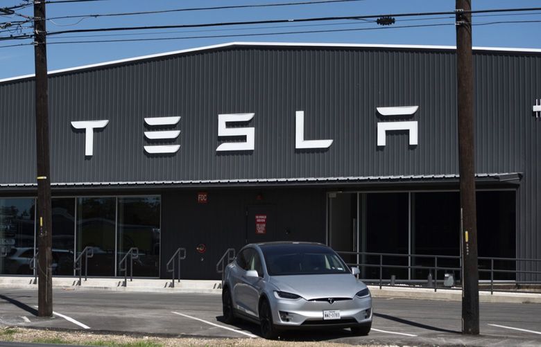 Signage outside the new Tesla South Austin showroom within the Yard development in Austin, Texas, U.S., on Saturday, Oct. 16, 2021. . Photographer: Mark Felix/Bloomberg