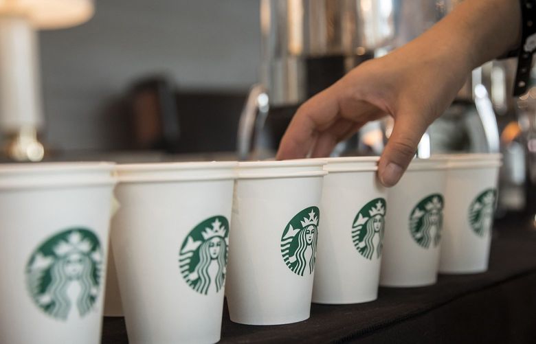 The Starbucks logo seen on paper cups at a press conference to announce a strategic partnership between Starbucks and Alibaba in Shanghai, China on Aug. 2, 2018.