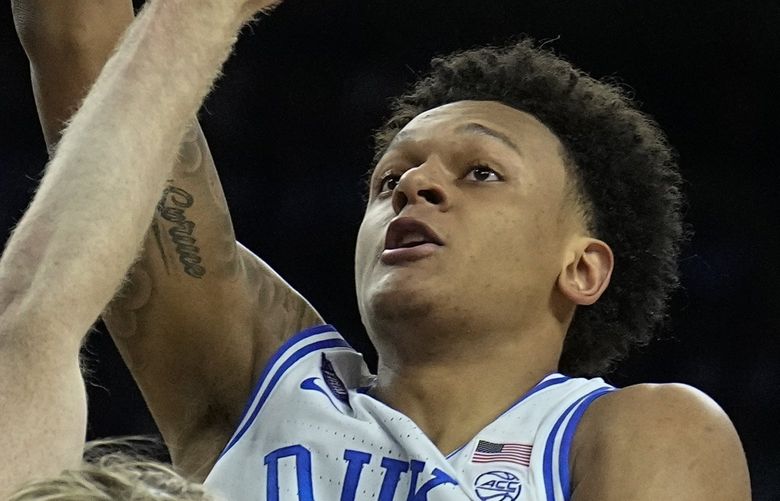 Duke’s Paolo Banchero (5) shoots over North Carolina’s Brady Manek (45) during the first half of a college basketball game in the semifinal round of the Men’s Final Four NCAA tournament, Saturday, April 2, 2022, in New Orleans. (AP Photo/Brynn Anderson)