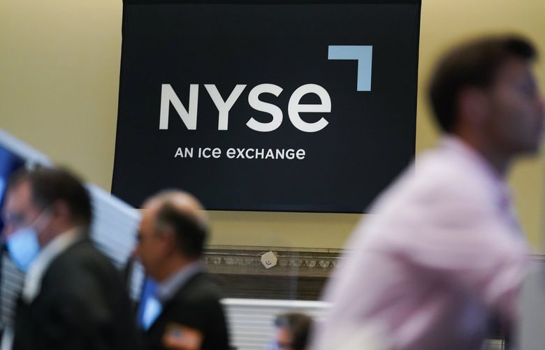 An NYSE sign is seen on the floor at the New York Stock Exchange in New York, Wednesday, June 15, 2022. (AP Photo/Seth Wenig)