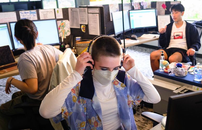 Vivian, a volunteer at Teen Link dons a headset to take a call. She and three other teens, all volunteers, provide a safe place for youth in need of mental health support to call.
Photographed Wednesday, June 22, 2022 220762