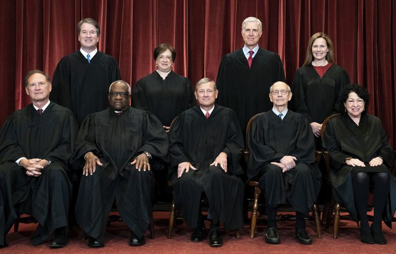 FILE – Members of the Supreme Court pose for a group photo at the Supreme Court in Washington, April 23, 2021. Seated from left are Associate Justice Samuel Alito, Associate Justice Clarence Thomas, Chief Justice John Roberts, Associate Justice Stephen Breyer and Associate Justice Sonia Sotomayor, Standing from left are Associate Justice Brett Kavanaugh, Associate Justice Elena Kagan, Associate Justice Neil Gorsuch and Associate Justice Amy Coney Barrett. The Supreme Court has ended constitutional protections for abortion that had been in place nearly 50 years â€” a decision by its conservative majority to overturn the court’s landmark abortion cases. (Erin Schaff/The New York Times via AP, Pool, File) NYNYT312 NYNYT312