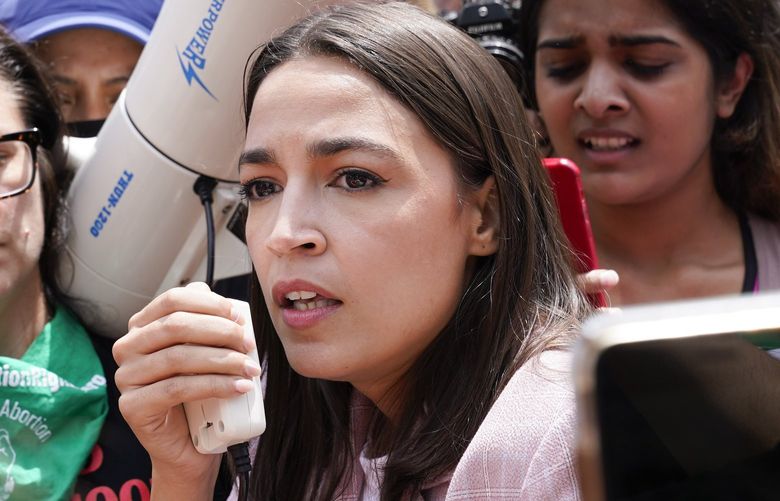 Rep. Alexandria Ocasio-Cortez, D-N.Y., joins abortion-rights activists as they demonstrate following Supreme Court’s decision to overturn Roe v. Wade in Washington, Friday, June 24, 2022. The Supreme Court has ended constitutional protections for abortion that had been in place nearly 50 years, a decision by its conservative majority to overturn the court’s landmark abortion cases.(AP Photo/Jacquelyn Martin) DCJM441 DCJM441