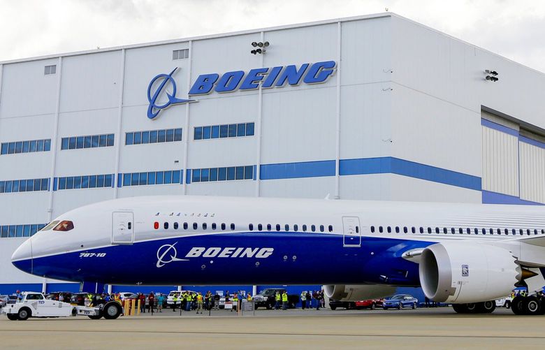 FILE – In this March 31, 2017, file photo, Boeing employees stand near the new Boeing 787-10 at the company’s facility in North Charleston, S.C. Federal officials are seeking to fine Boeing $1.25 million, saying Wednesday, Aug. 5, 2020, that company managers pressured employees who were designated to perform safety-related work at the plant. The Federal Aviation Administration said that for nearly two years Boeing made employees doing safety checks report to managers who weren’t in position to oversee the work. (AP Photo/Mic Smith, File) NYDB306