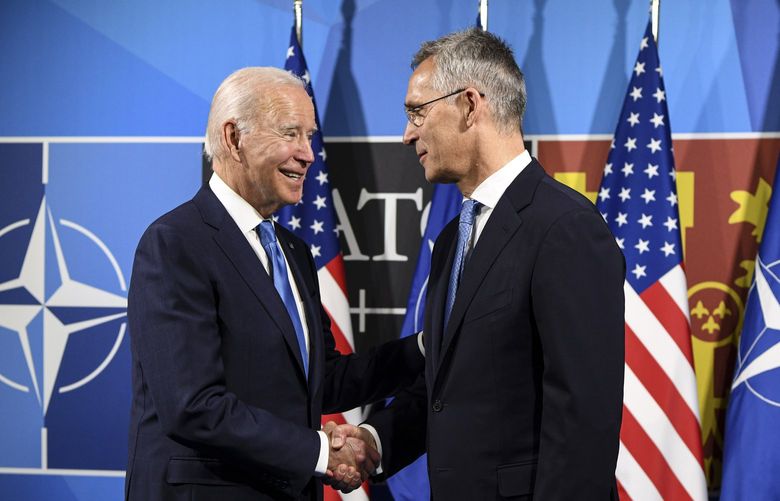 President Joe Biden of the U.S., left, meets with NATO Secretary-General Jens Stoltenberg at the NATO summit in Madrid on Wednesday, June 29, 2022. (Kenny Holston/The New York Times) XNYT6 XNYT6