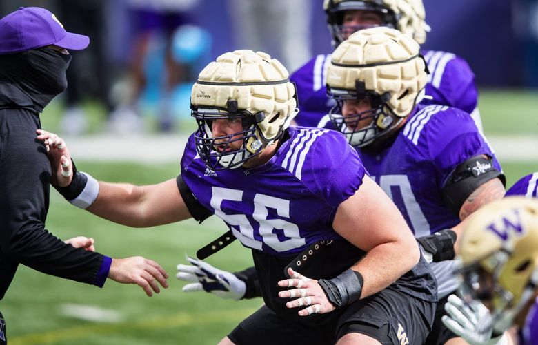 Offensive lineman Geirean Hatchett works out as the University of Washington Huskies participate in their spring practice at Husky Stadium Saturday April 10, 2021 in Seattle. 216808