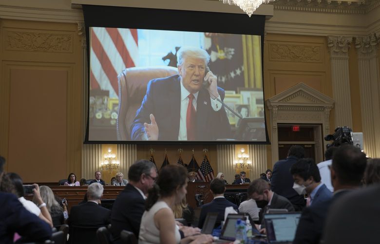 A photograph of President Donald Trump speaking on the phone to Vice President Mike Pence is displayed during a hearing of the House Select Committee investigating the Jan. 6 attack on the Capitol at the Capitol in Washington, June 16, 2022. As House hearings highlighted testimony that could create more pressure to pursue a criminal case, the former president tried out a defense that strained credulity. (Doug Mills/The New York Times)  XNYT63 XNYT63