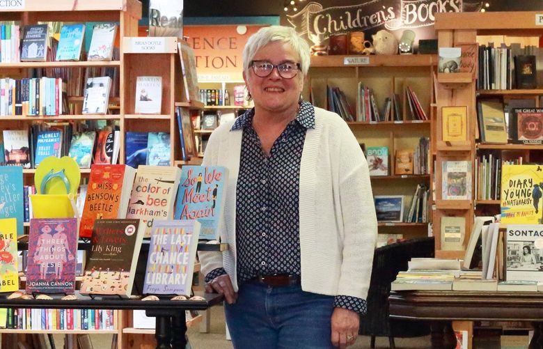 Vashon Bookshop owner Nancy Katica poses in her downtown Vashon bookstore. Katica credits the shop’s generous store credit program for building a relationship with customers. “It’s a great way for us to see what the island is interested in and what people are actually reading,” she says.