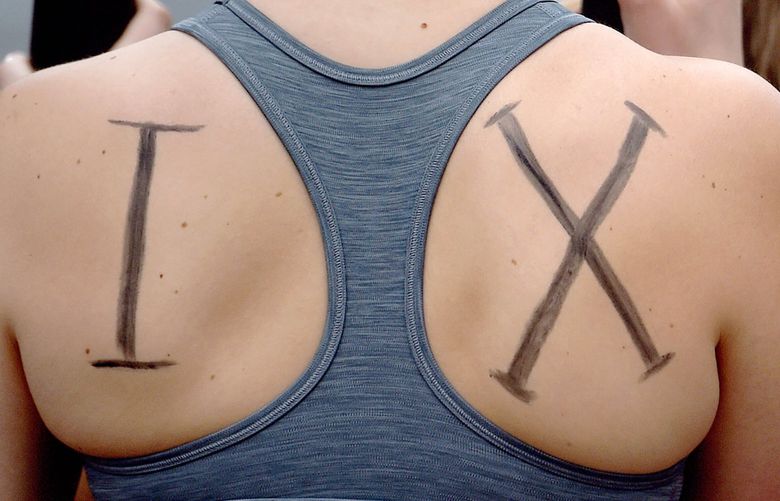 FILE – Members of the UConn women’s rowing team rally about being cut by the university after the season, in Storrs, Conn., April 19, 2021. (Brad Horrigan/Hartford Courant via AP, File) CTHAR350 CTHAR350