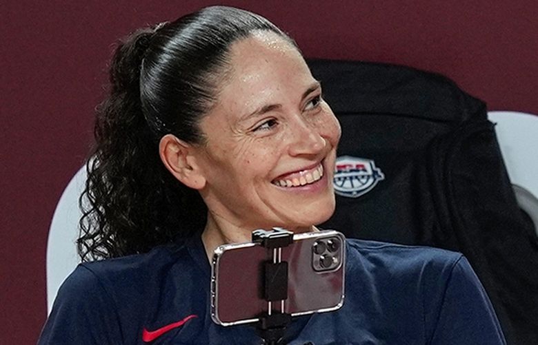 United States’ Sue Bird uses her phone to take video of teammates during a women’s basketball practice at the 2020 Summer Olympics, Saturday, July 24, 2021, in Saitama, Japan. (AP Photo/Eric Gay) OLYEG131 OLYEG131