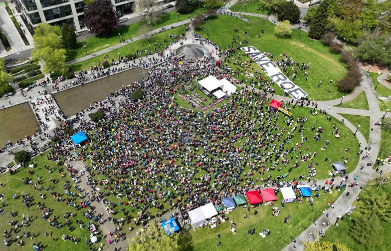 Supporters of abortion rights gather Saturday at Cal Anderson Park in Seattle. The rally is among demonstrations around the country Saturday to advocate that the half-century right to legal abortions continue. (Daniel Kim / The Seattle Times)