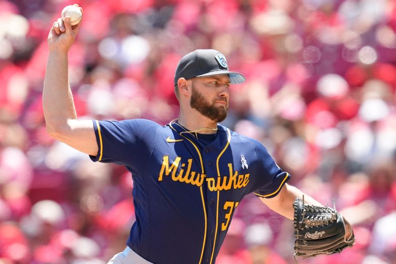 Hoby Milner of the Milwaukee Brewers throws during a baseball game