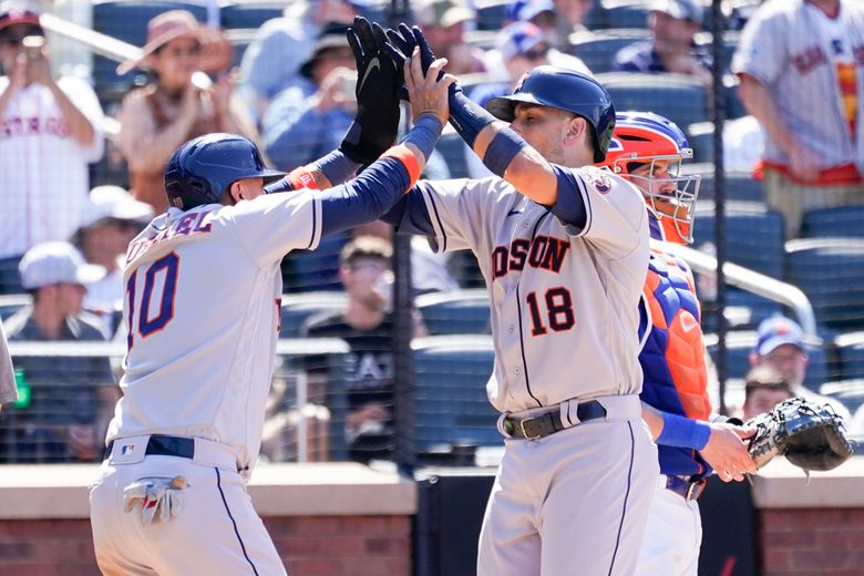 Houston Astros' Jason Castro watches the ball after hitting a two