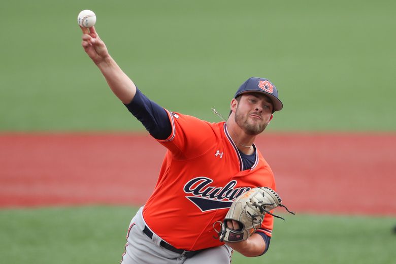 Auburn infielder Cole Foster (7) runs to first after hitting a