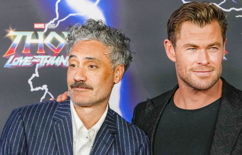 FILE – Australian actor Chris Hemsworth, right, and New Zealand director Taika Waititi appear at the premiere of “Thor: Love and Thunder”  in Sydney, Australia, Monday, June 27, 2022. Waititi has emerged as the unlikely dynamo behind some of Hollywood’s biggest properties. (AP Photo/Mark Baker, File) NYET301