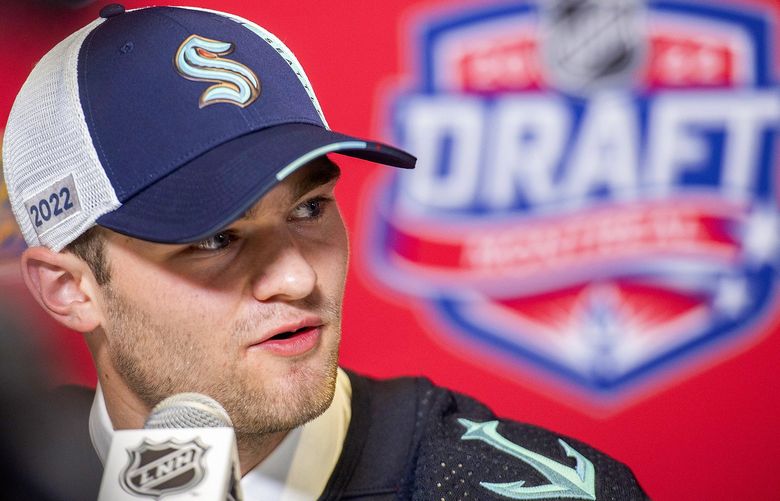 Shane Wright speaks during a news conference after being selected as the fourth overall pick by the Seattle Kraken during the first round of the NHL hockey draft in Montreal on Thursday, July 7, 2022. (Graham Hughes/The Canadian Press via AP) GMH123