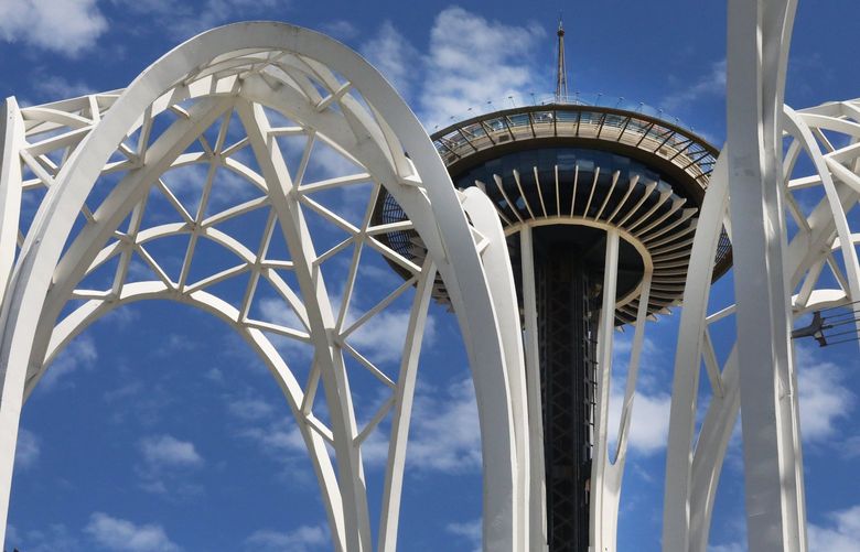 The distinctive Pacific Science Center arches frame the Space Needle at Seattle Center.

 Part of a roundup of arts and culture things to do with the family this summer.

Pacific Science Center, Thursday July 7, 2022 220938