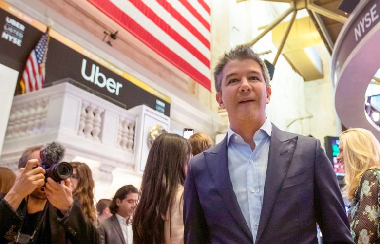 Travis Kalanick, founder and former chief executive officer of Uber Inc., center, stands on the trading floor during the company’s initial public offering (IPO) at the New York Stock Exchange (NYSE) in New York, U.S., on Friday, May 10, 2019. The No. 1 ride-hailing company’s shares will start trading on the New York Stock Exchange after it raised $8.1 billion in the biggest U.S. IPO since 2014, pricing shares at $45 each. 775340026