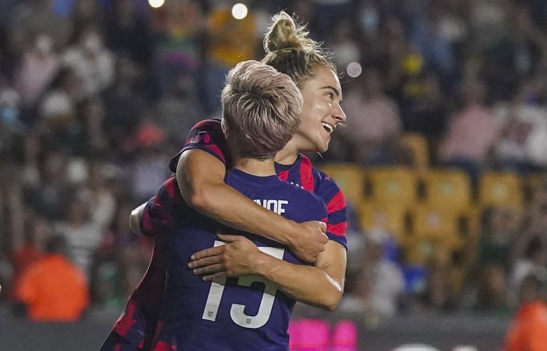 United States’ Kristie Mewis is congratulated by teammate Megan Rapinoe after scoring her side’s opening goal against Mexico during a CONCACAF Women’s Championship soccer match in Monterrey, Mexico, Monday, July 11, 2022. (AP Photo/Fernando Llano) XMC159 XMC159