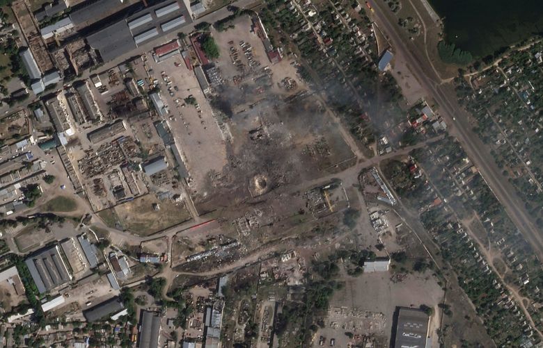 This satellite image from Planet Labs PBC shows the aftermath of a Ukrainian strike on a Russian ammunition depot in Nova Kakhovka, Ukraine, Tuesday, July 12, 2022. Ukrainian authorities said Tuesday that their forces targeted the Russian ammunition depot in southern Ukraine overnight, resulting in a massive explosion captured on social media. (Planet Labs PBC via AP) XJG102 XJG102