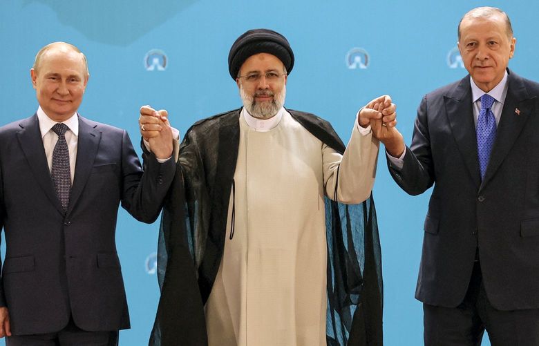Russian President Vladimir Putin, left, Iranian President Ebrahim Raisi, center, and Turkish President Recep Tayyip Erdogan pose for a photo prior to their talks at the Saadabad palace, in Tehran, Iran, Tuesday, July 19, 2022. (Sergei Savostyanov, Sputnik, Kremlin Pool Photo via AP) XAZ114 XAZ114