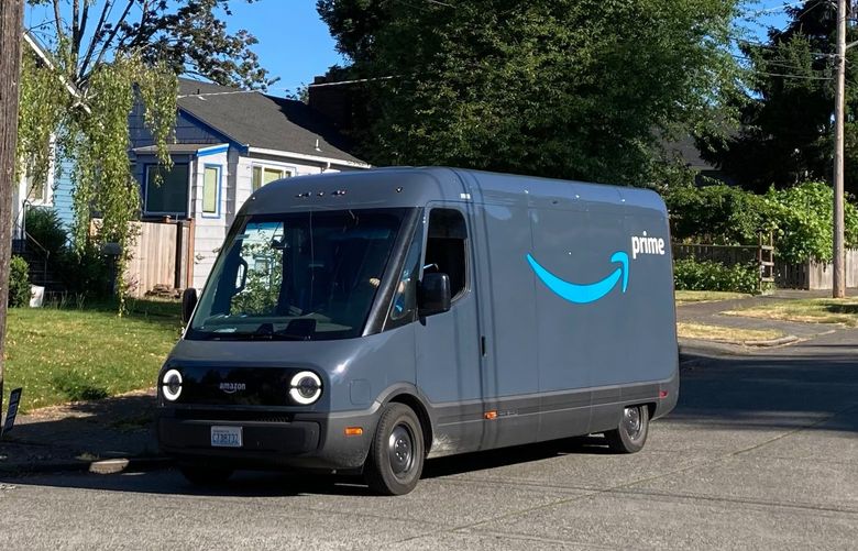 A Rivian electric van for Amazon Prime makes deliveries in the Columbia City neighborhood of Seattle July 18, 2022.