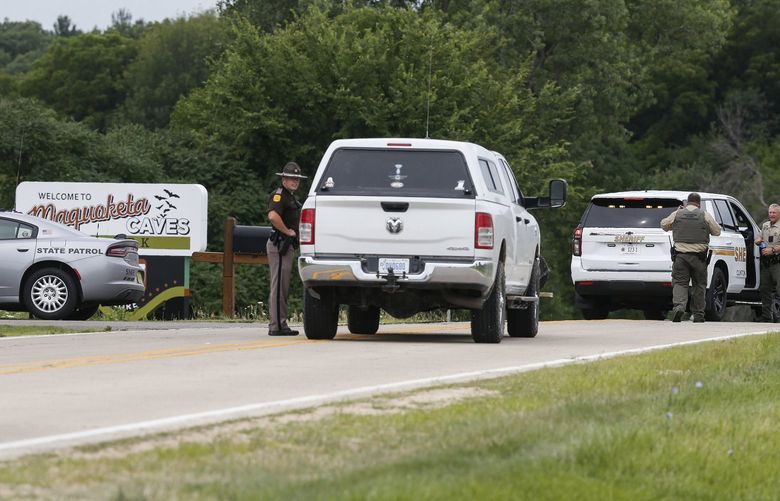 Emergency personnel block an entrance to the Maquoketa Caves State Park as police investigate a shooting, Friday, July 22, 2022, in Maquoketa, Iowa. Police responded to reports of the shooting at the park’s campground before 6:30 a.m., Mike Krapfl, special agent in charge of the Iowa Division of Criminal Investigation, said in a statement. ( (Dave Kettering/Telegraph Herald via AP) IADUB301 IADUB301