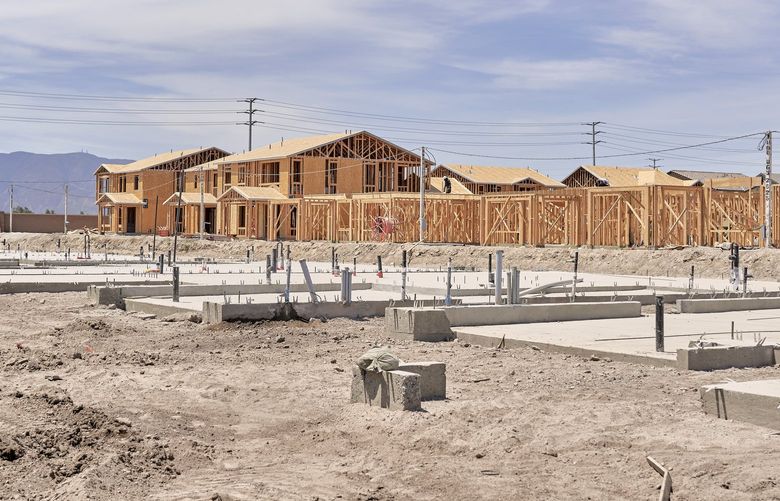 Houses under construction by Lewis Group of Companies in Chino, Calif., on July 21, 2022. Right now, builders have too many homes and not enough people to sell them to, however, in the long term, the U.S will have the opposite problem. (Philip Cheung/The New York Times)
