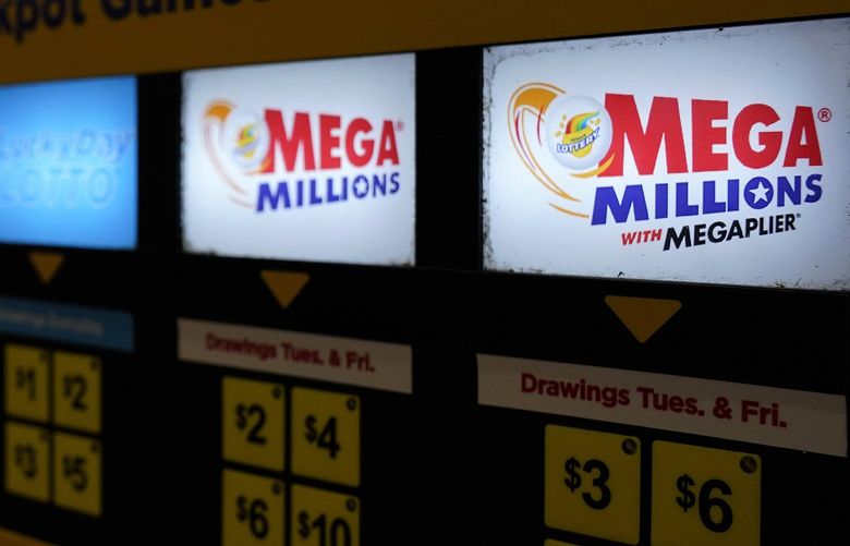 FILE – A lottery ticket vending machine sits a convenience store, July 21, 2022, in Northbrook, Ill. The next Mega Millions drawing is Tuesday, July 25, 2022 with a jackpot at $790 million. (AP Photo/Nam Y. Huh, file) NYPS201 NYPS201