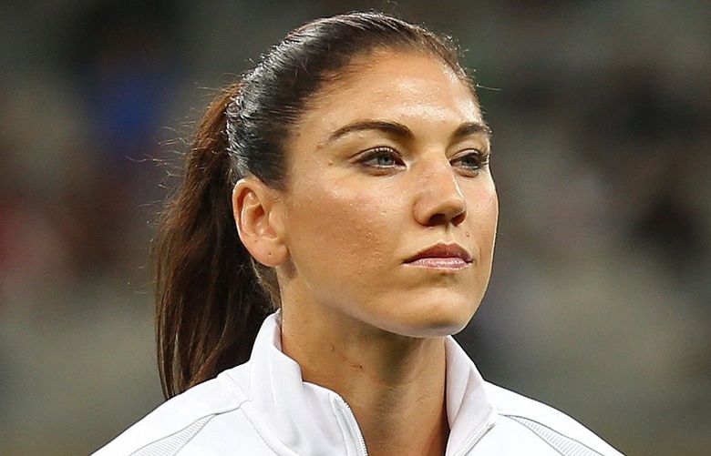 United States goalkeeper Hope Solo stands as players listen to the national anthems before a women’s Olympic football tournament match against New Zealand at the Mineirao stadium in Belo Horizonte, Brazil, Wednesday, Aug. 3, 2016. Solo says she was not bothered by fans who chanted “Zika, Zika” at her as the U.S. women’s soccer team defeated New Zealand in its Olympic debut on Wednesday. The crowd jeered the goalkeeper with the reference to the virus that has scared many athletes ahead of the Rio Games.(AP Photo/Eugenio Savio)