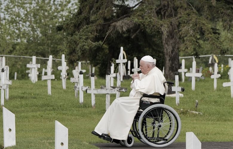 Pope Francis prays during a visit to a cemetery at a former residential school in Maskwacis, Alberta, Canada, July 25, 2022. Pope Francis’s first apology in Canada to Indigenous people for the abuse they suffered at residential schools will be made in an intimate setting, at the Ermineskin Cree Nation, the site of one of the 130 schools that were once spread across most of Canada. (Ian Willms/The New York Times) XNYT26 XNYT26