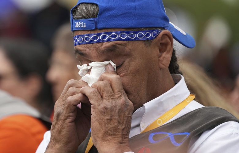 An Indigenous man wipes away tears after Pope Francis delivered his apology to Indigenous people for the church’s role in residential schools during a ceremony in Maskwacis, Alberta, as part of his papal visit across Canada on Monday, July 25, 2022. (Nathan Denette/The Canadian Press via AP) NSD524 NSD524