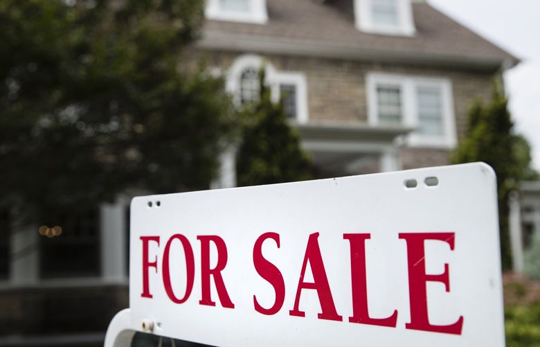FILE – A “for sale” sign stands in front of a house in Pennsylvania, near Philadelphia, on June 8, 2018. A Pennsylvania mortgage company owned by billionaire businessman Warren Buffett discriminated against potential Black and Latino homebuyers in Philadelphia, New Jersey and Delaware, the Department of Justice said Wednesday, July 27, 2022, in what they are calling the second-largest redlining settlement in history. (AP Photo/Matt Rourke, File) NYSS301 NYSS301