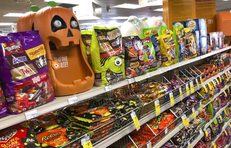 Halloween candy and decorations are displayed at a store, Wednesday, Sept. 23, 2020, in Freeport, Maine. U.S. sales of In this year of the pandemic, with trick-or-treating still an uncertainty, Halloween candy were up 13% over last year in the month ending Sept. 6, according to data from market research firm IRI and the National Confectioners Association. (AP Photo/Robert F. Bukaty) MERB202