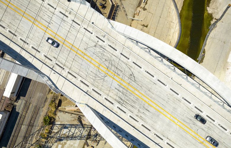 Skid marks on the Sixth Street Viaduct in Los Angeles, July 27, 2022. The long-awaited Sixth Street Viaduct has proved to be irresistible to pedestrians and neighborhood residents — but also graffiti artists and exhibitionist drivers. (Hunter Kerhart/The New York Times) XNYT95