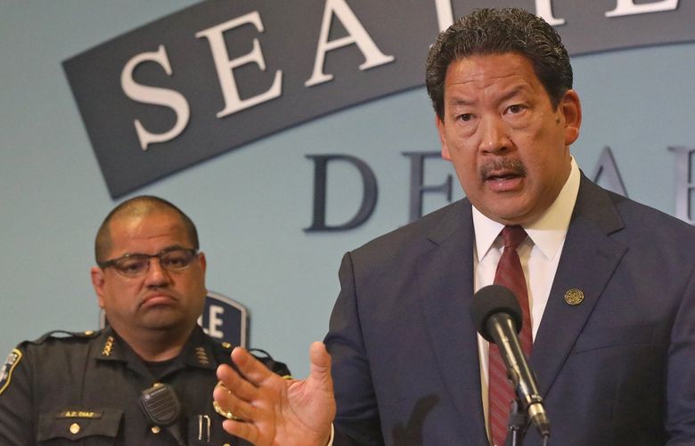 Seattle Police Chief Adrian Diaz, left, and Mayor Bruce Harrell announce a plan for hiring/retaining more police officers Wednesday, July 13, 2022 at a media event at police headquarters. 220975