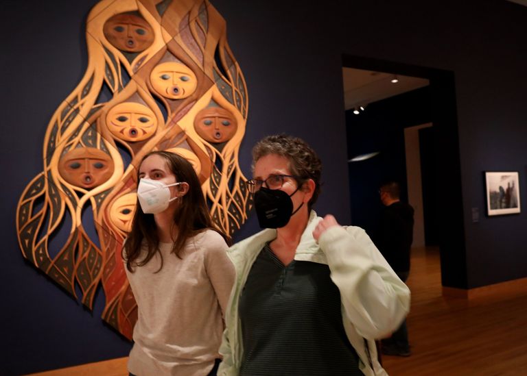 Visitors check out exhibits at the Seattle Art Museum in May 2022