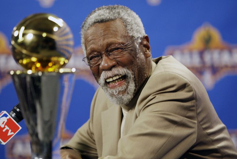 NBA great Bill Russell laughs at a news conference as he learns the most valuable player award for the NBA championships has been renamed for him in 2009 in Phoenix. (Matt York / The Associated Press)