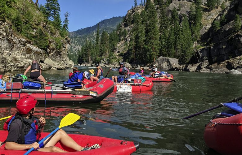 Our group of 15 passengers and five guides looks downriver as we launch take off from Corn Creek onto the River of No Return in Idaho for a five-day, 80-mile stretch through the Frank Church Wilderness.